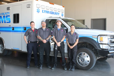 Our EMS Staff standing outside an Ambulance